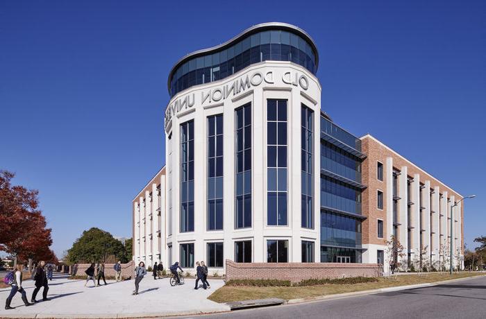 Students walk near Education Building